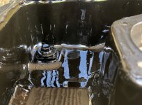 Undrained oil in sump - volume created by recessed drain plug R.jpg